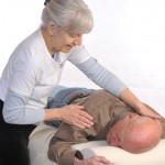 Linda Cifelli giving Healing Touch therapy to a client